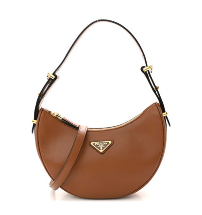PRADA 
Soft Calfskin Arque Shoulder Bag Cognac