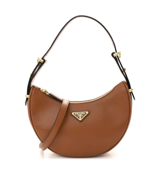 PRADA 
Soft Calfskin Arque Shoulder Bag Cognac
